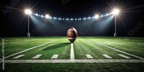 Night Game Ready A lone football rests at midfield under stadium lights, awaiting the thrill of competition.