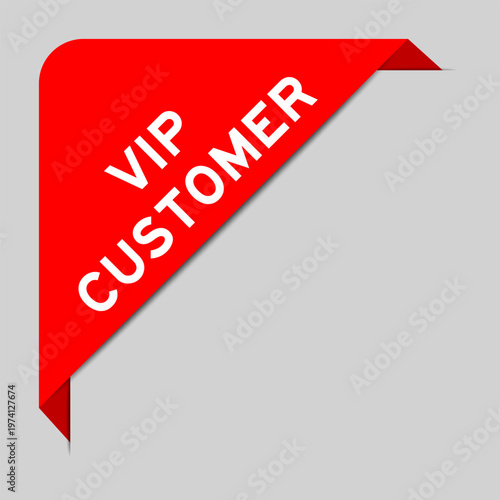 Red color of corner label banner with word VIP customer on gray background