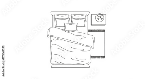 Top-down view of a neatly made bed with pillows and duvet.