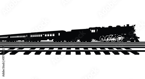 Vintage steam train travels along railway tracks a striking black silhouette