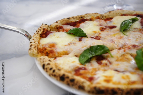 Tableau sur toile Delicious Hot Margherita Pizza on White Plate with Marble Background