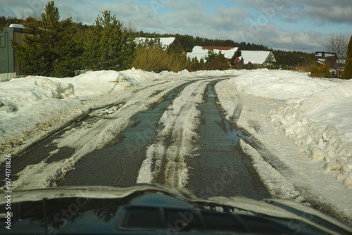 Fotografija thawing snow on the asphalt