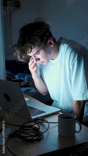 Exhausted Freelance Coder Working on Laptop at Night - Authentic Messy Desk
