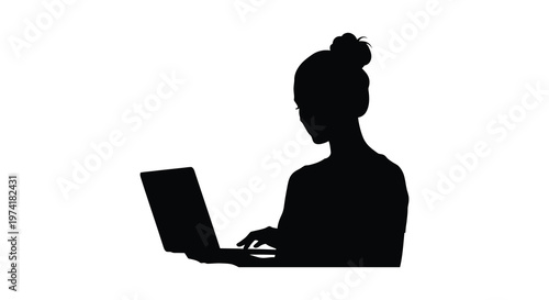 Woman working on a laptop viewed in profile a striking silhouette