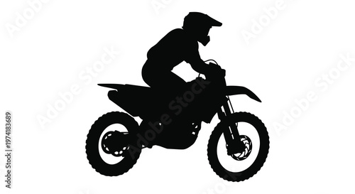 Motorcross rider on a bike in dynamic motion striking black silhouette
