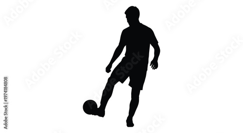 A dynamic soccer player kicking a ball captured in black silhouette