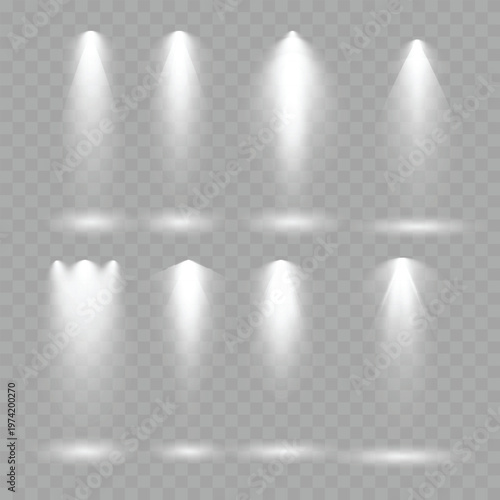 Realistic White Spotlight Beams Set. Vector Stage Illumination and Glowing Light Rays on Transparent Background.