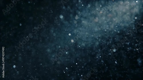 Sparkling particles suspended in a dark, ethereal environment.