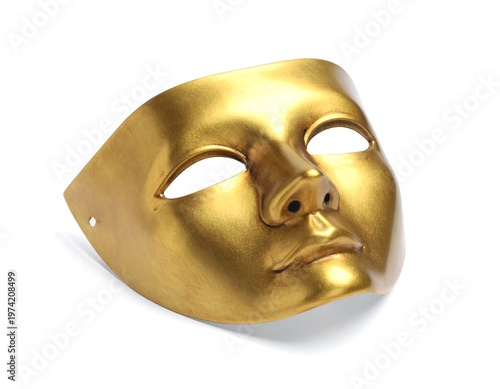 Golden, theatrical face mask, resting on white surface. This symmetrical, decorative object has eye openings and a nose. A simple, smooth design