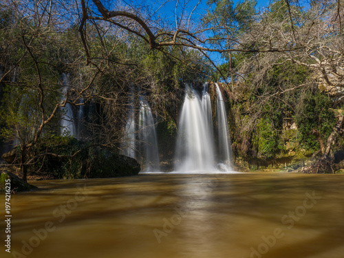 stunning natural waterfall cascading over rocks in a forest