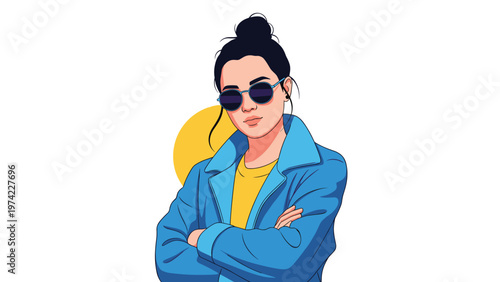 Confident young woman with a hair bun wearing round sunglasses and a blue jacket standing with her arms crossed against a yellow sun background.