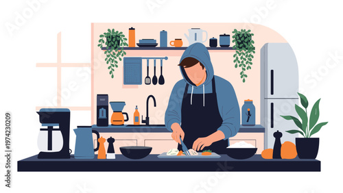 Skilled home cook wearing a hoodie and apron while carefully chopping fresh vegetables on a counter in a modern kitchen.