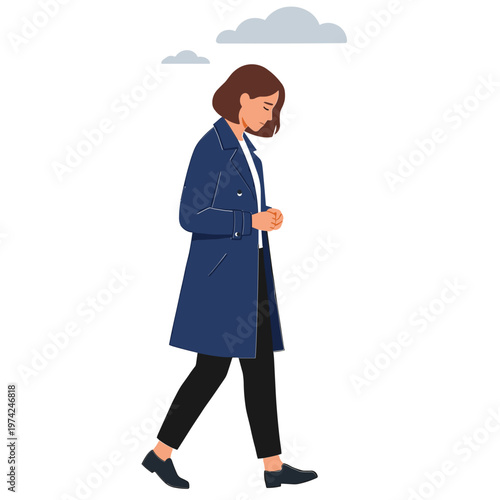 Woman walks alone outside on a cloudy day wearing a blue coat