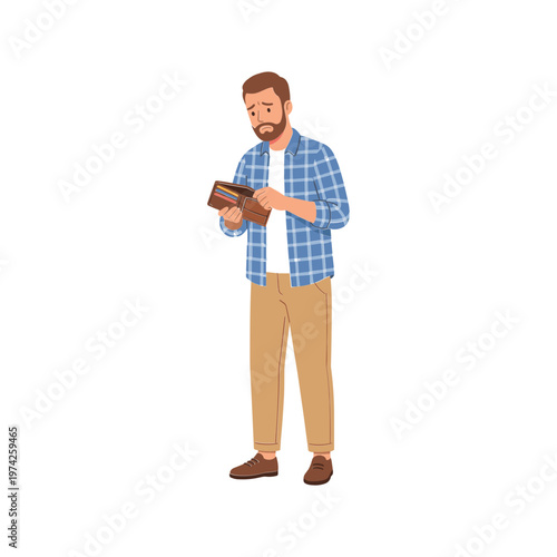 A man in a blue plaid shirt reading a book indoors