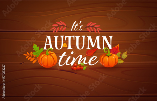 Thanksgiving greeting card quote it is autumn time. Warm, rustic card featuring colorful fall leaves, pumpkins and rowan berries on wooden background. Cozy vector design for Thanksgiving wishes