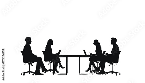 Business team collaborating around a conference table with laptops, engaging in a productive work session.