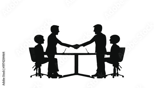 Two businessmen shake hands across a table signifying a successful business deal and partnership.