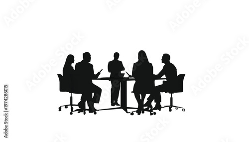 Business team in silhouette sitting around a table, engaged in a meeting or collaborative work session.