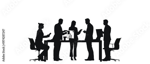 Business team in silhouette is actively engaged around a conference table, sharing documents and information.