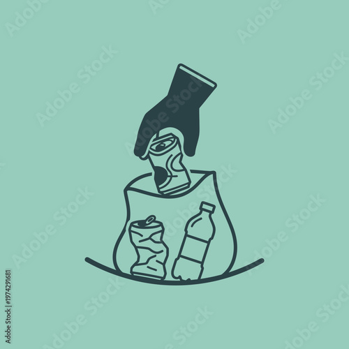 Hand putting trash into recycling bin.