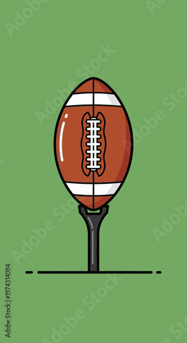 American Football Placed On A Tee Against A Green Background