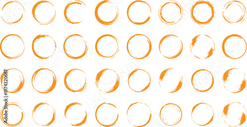 Multiple golden rings arranged in rows on a white background in various orientations and positions