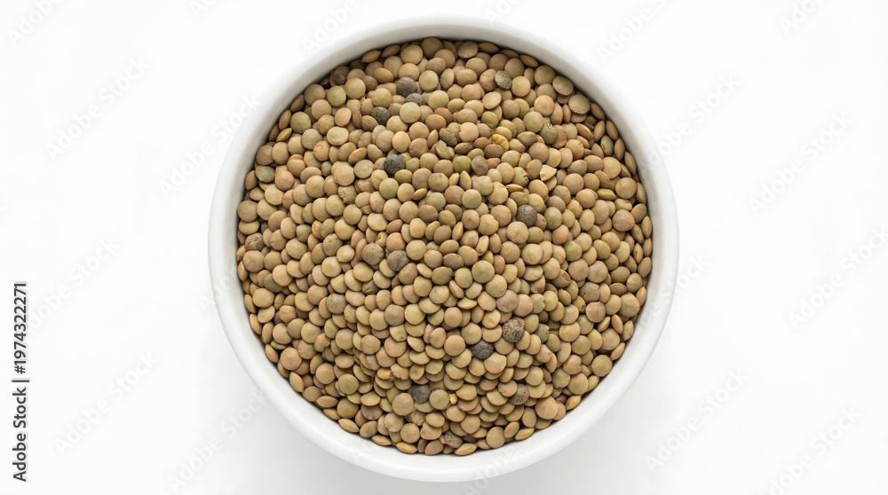 Obraz premium A bowl of brown lentils on a white background