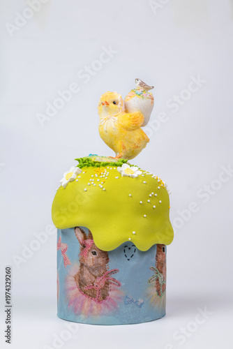 Easter Kulich in Decorated Mold with Yellow Icing, Sugar Chick, and Bird