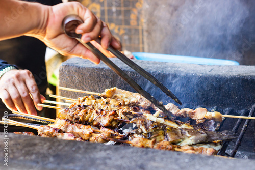 Filipino barbecue skewers made with grilled pork and chicken. typical Filipino food or picnic meal in the Philippines.