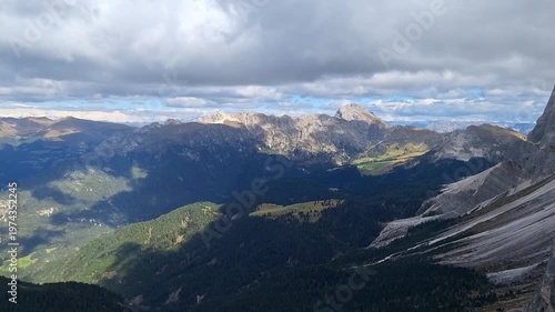 View of Mount Seceda in cloudy autumn weather.