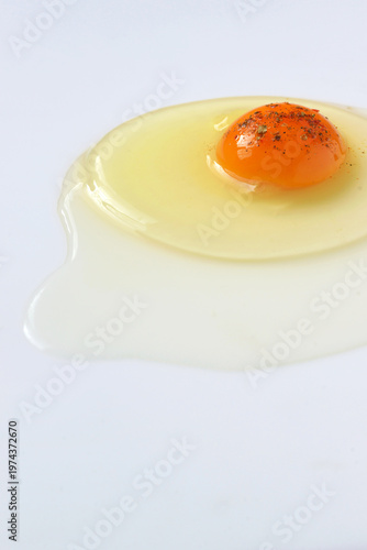 Fresh yolk egg isolated on white table