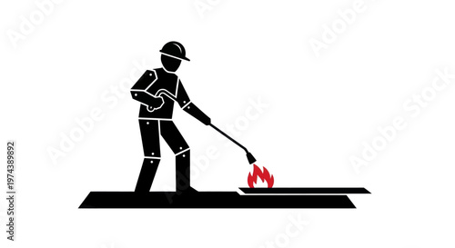 Worker with welding torch in action industrial setting.