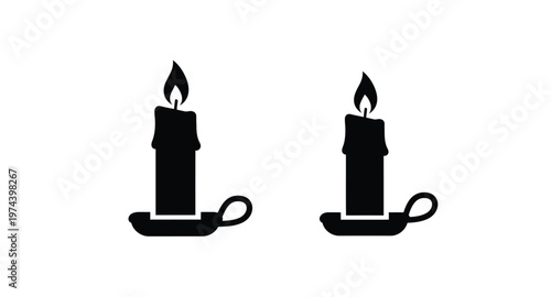 Two black candles with holders on transparent background silhouette