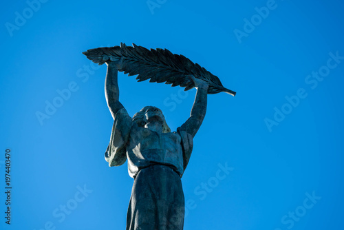 Liberty Statue at Citadella in Budapest, Hungary, rising against a clear blue sky and symbolizing freedom at a newly reopened historic landmark.
