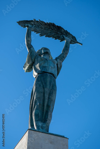 Liberty Statue at Citadella in Budapest, Hungary, rising against a clear blue sky and symbolizing freedom at a newly reopened historic landmark.