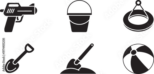 Collection of beach toys and a firearm, including a bucket, shovel, inflatable ring, and a beach ball, suggesting playtime and potential danger.
