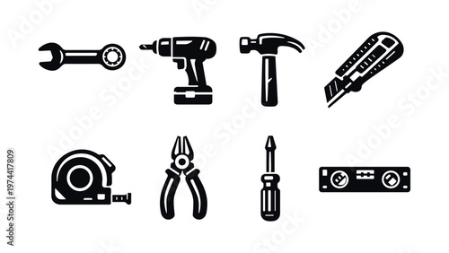 Black and white silhouette of hand tools illustration featuring drill wrench hammer