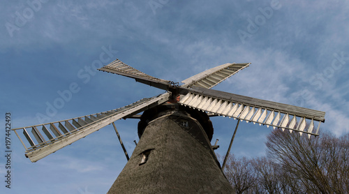 old windmill outdoors under blue sky