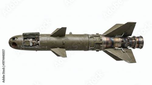 A detailed view of a military guided missile or bomb, showcasing its complex engineering and design against a white background.