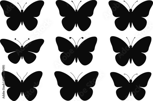 Collection of black butterfly silhouettes on a, various poses and wing shapes