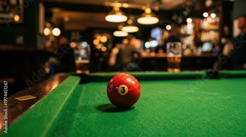A single vivid red billiard ball resting on the smooth emerald green baize surface of a pool table, the ball's glossy finish perfectly reflecting the warm glowing bar lights above, blurred pub