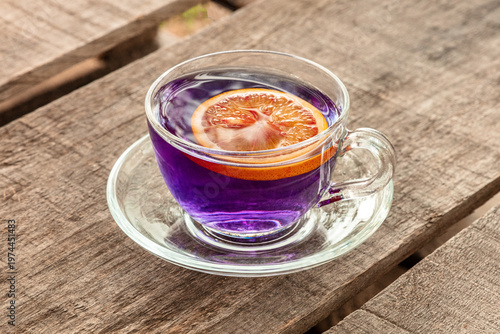 Blue tea, an infusion of butterfly pea flowers, with a citrus