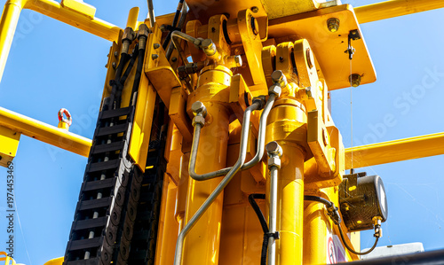  Induastrial machine pattern with yellow tolls and steel cable elements of industry production line on a factory. Manufacturing concept background for workplace desing .