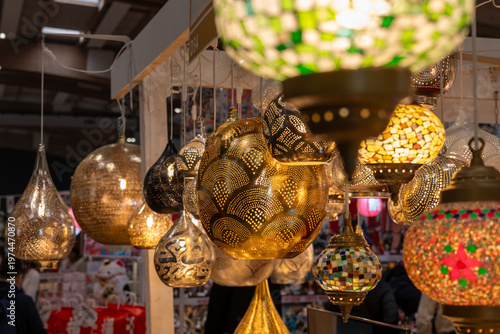 Traditional oriental hanging lamps and decorative ethnic crafts in a boutique market.