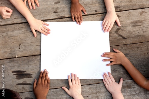Diverse hands around paper