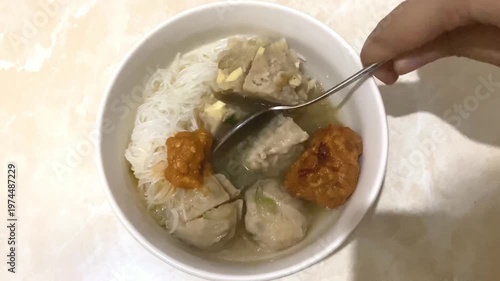 Bakso Dish Being Served with Spoon - Top View
