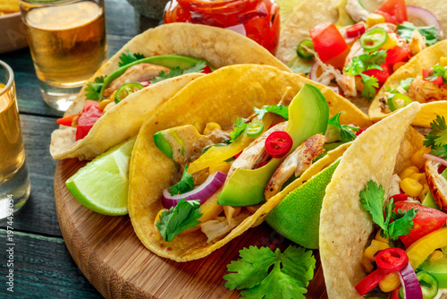 Wallpaper Mural Mexican tacos with pulled chicken, avocado, chili peppers, a close-up with tequila shots and limes Torontodigital.ca