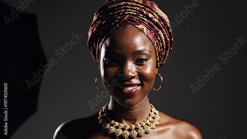 Close-up of a Beautiful African Woman Smiling with a Headwrap and Gold Jewelry.