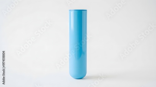 A single tall slender light blue cylinder shaped modern decorative vase stands upright on a clean white surface