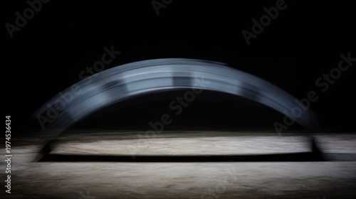 Dynamic fan-shaped motion blur from a swift strike on dark background. lifestyle magazines, social media lookbooks, designed for lifestyle magazines and social media content.